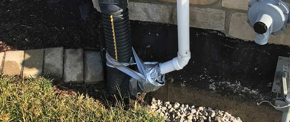 Downspout in need of drainage correction in Columbia, IL.