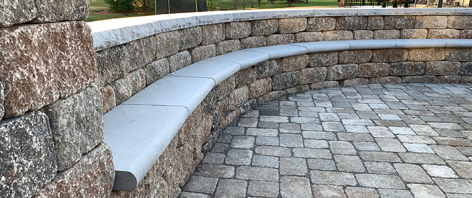 A patio with surrounding retaining wall build on a property in Columbia, IL.
