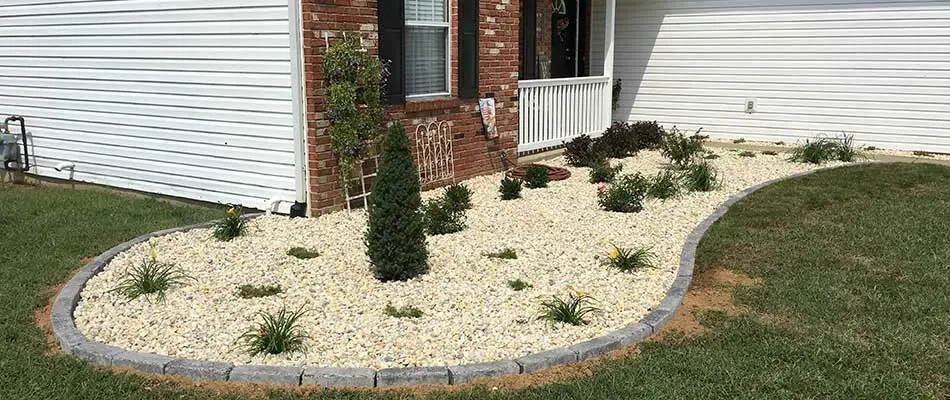 New rock mulch landscape bed at a residential property in Waterloo, Illinois.