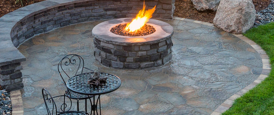 Custom flagstone patio and fire pit installation in Waterloo, IL.