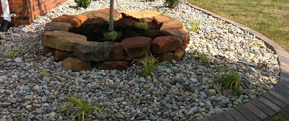 A landscape bed with rock ground cover that we just installed in Millstadt, IL.