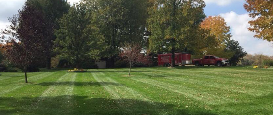 Linnemann Lawn Care & Landscaping work truck at a property with yard cleanup services in Millstadt, IL.